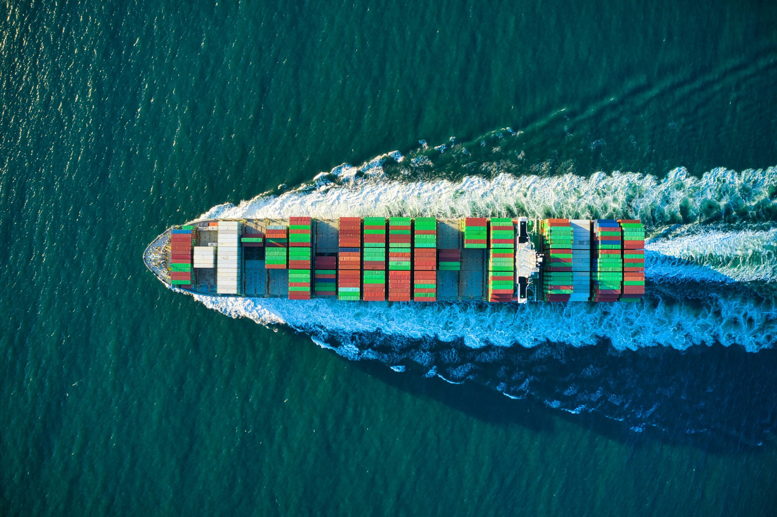colorful cargo chip heading west on water